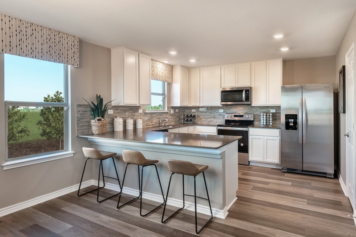 New Homes in San Antonio, TX - Preserve at Culebra - Heritage Collection Plan 2245 Kitchen as modeled at Deer Crest