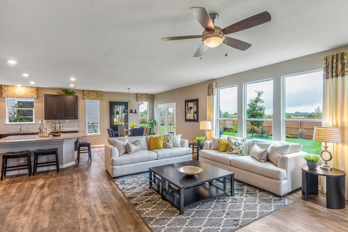 New Homes in Seguin, TX - Woodside Farms Plan 2897 Great Room as modeled at Falcon Landing