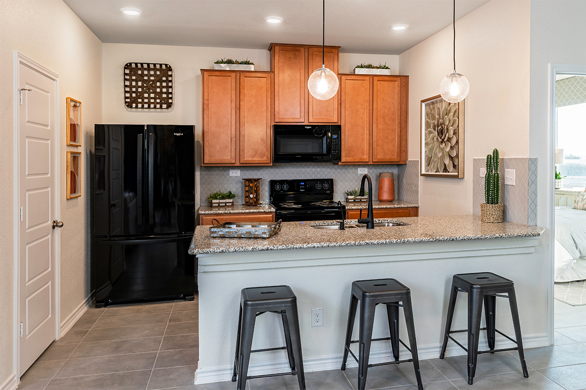 New Homes in San Antonio, TX - Hidden Canyons at TRP Plan 1416 Kitchen as modeled at Marbella