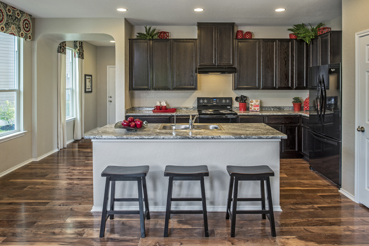New Homes in San Antonio, TX - Hidden Canyons at TRP Plan 1891 Kitchen as modeled at The Overlook at Medio Creek