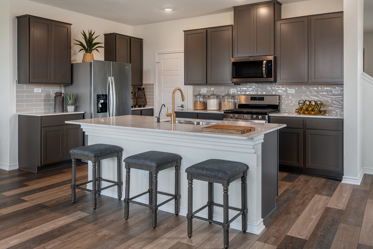 New Homes in Elmendorf, TX - Southton Cove Plan 2348 Kitchen as modeled at Willow View