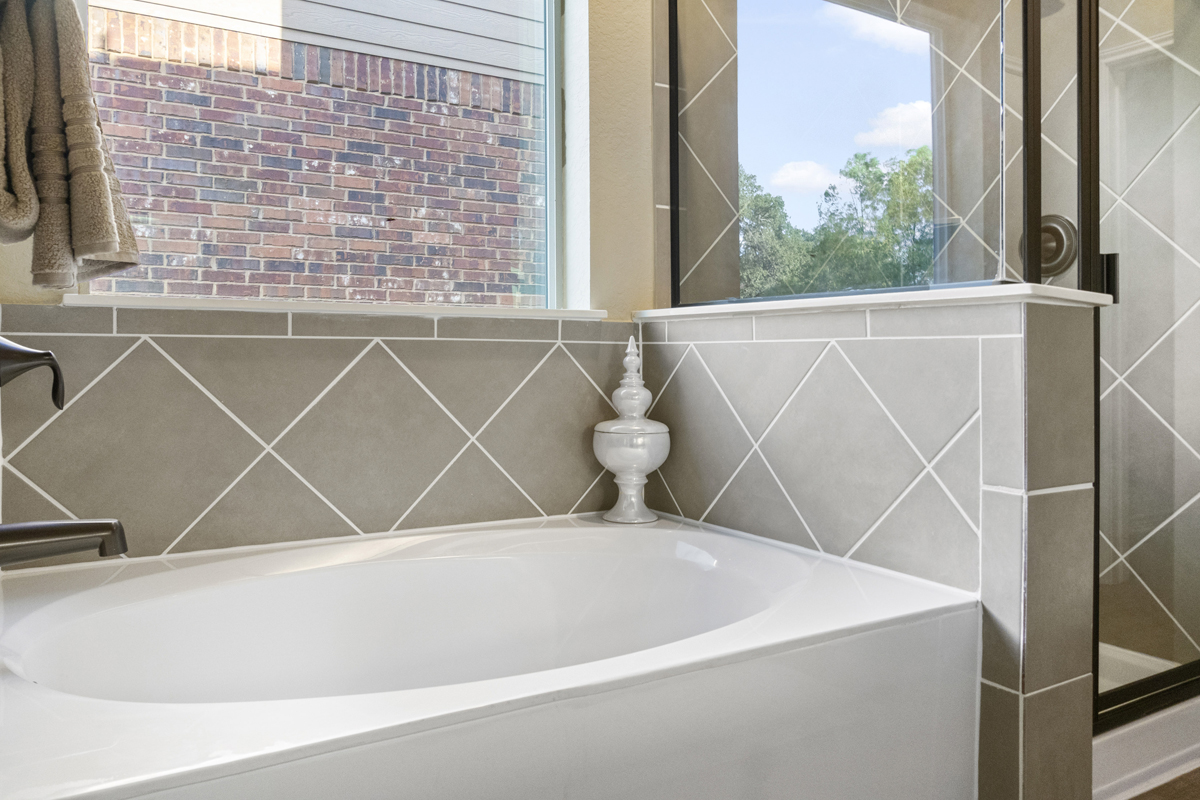 Marble garden tub and separate shower at bath