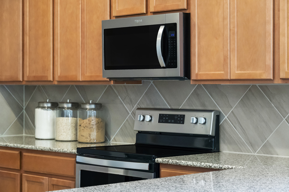 Whirlpool® glass cooktop range and microwave/hood combination