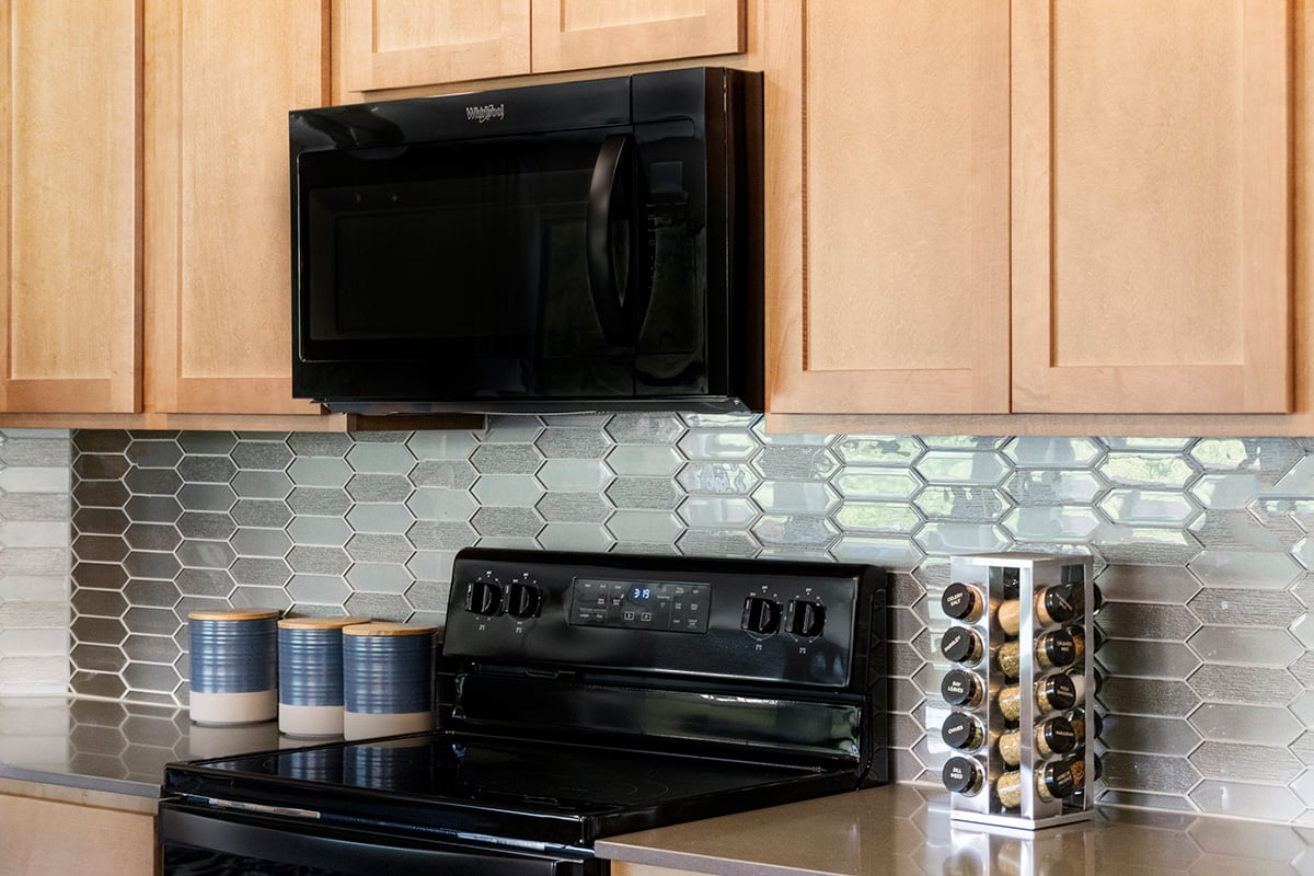 Glass mosaic tile backsplash