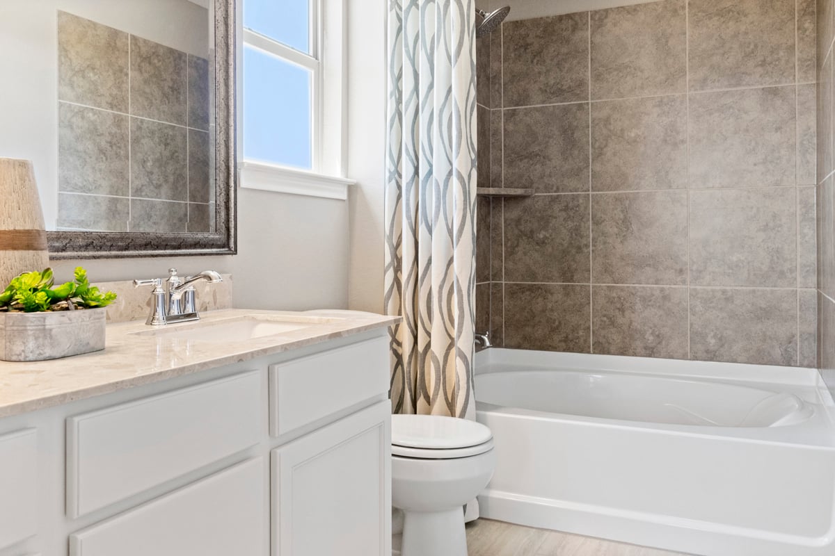 Tub with tile surround at secondary bath