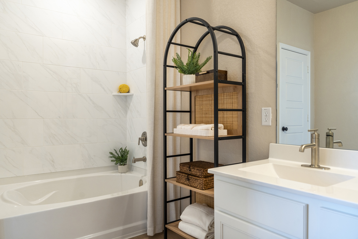 Garden tub with tile surround at primary bath