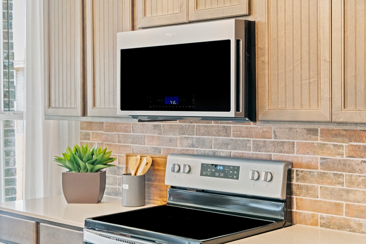 Whirlpool® glass cooktop range and microwave/hood combination