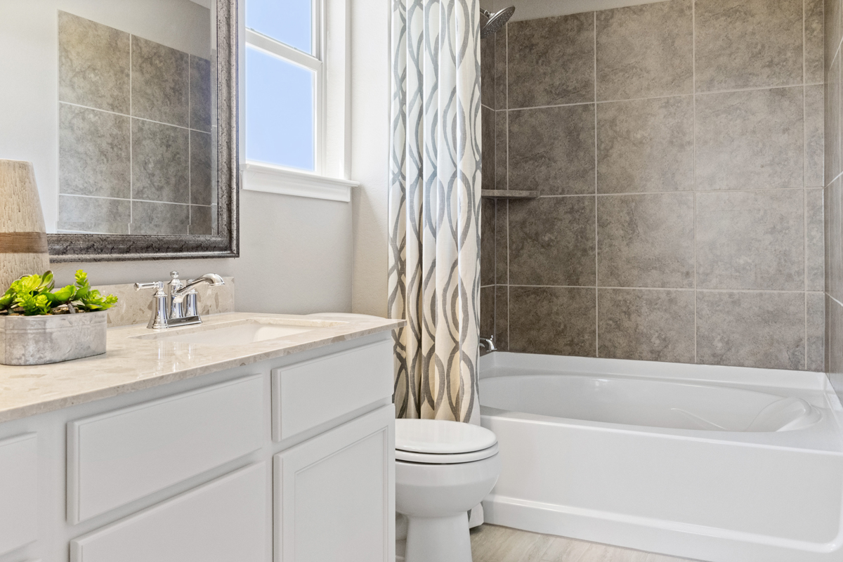 Tub with tile surround at secondary bath