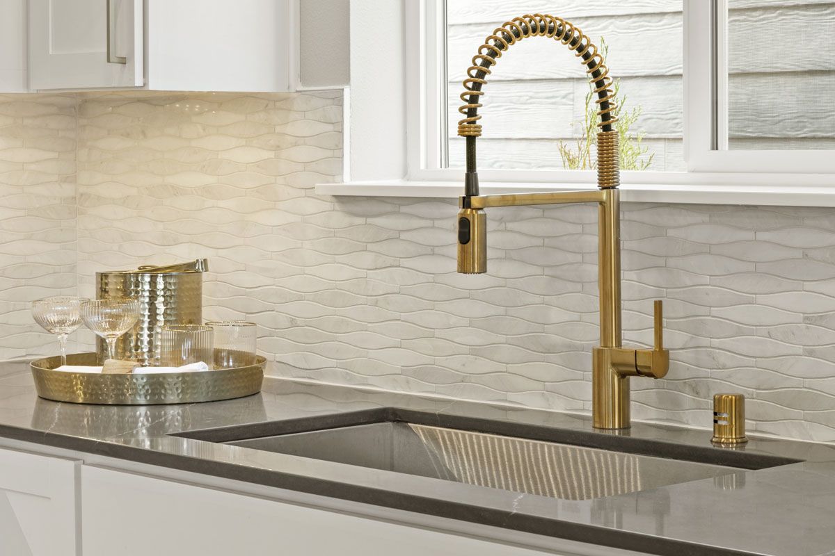 Brushed gold pulldown kitchen faucet